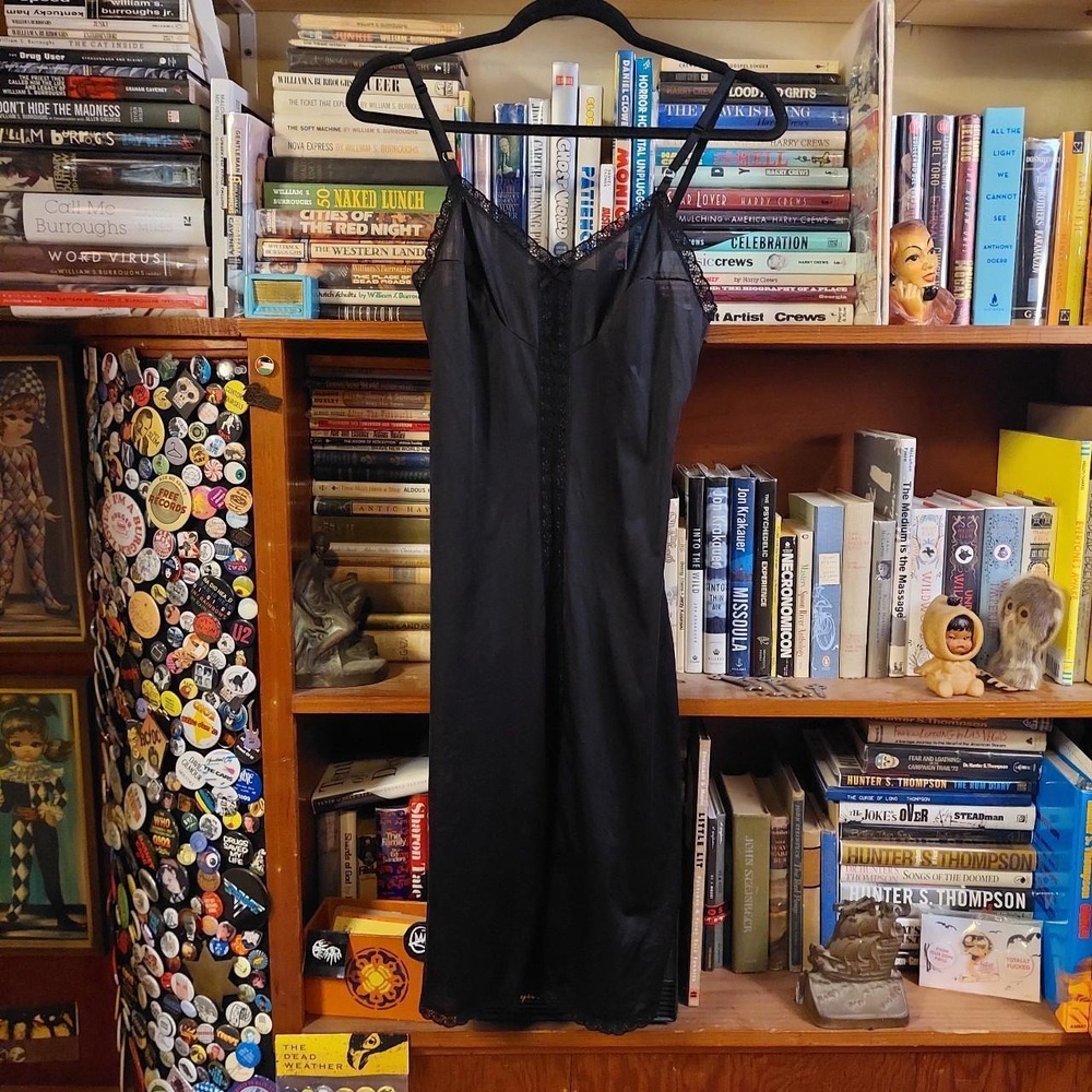 Vintage‎ black lace slip with slit on the center front.